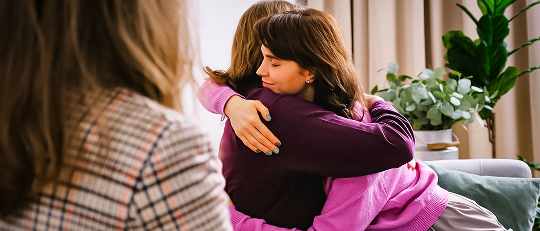 Family therapy session with emotional support and counseling guidance