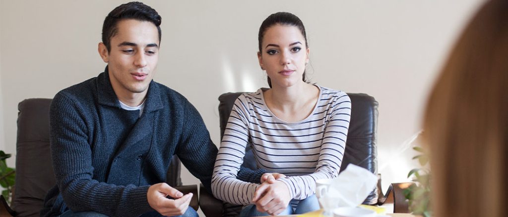 Couple facing emotional distance due to depression, guided by therapy