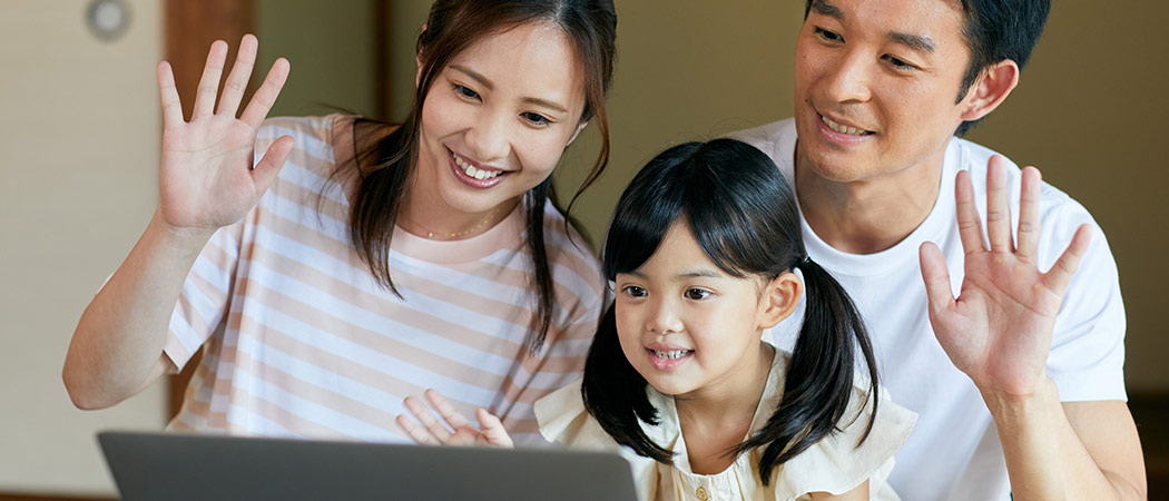 Online family therapy session with multiple family members connected virtually.